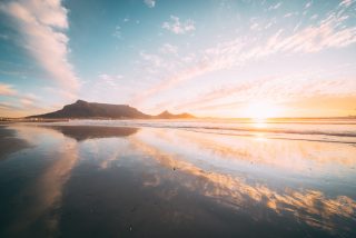 Table_mountain_reflection_from_milnerton_craig_howes.jpg